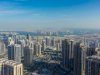 Should I wait or buy the opportunity when investing in real estate in Dubai?